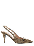 Chaussures Gucci beige en polyester à talons hauts, élégantes et sophistiquées, visibles sur l'image.