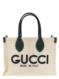 Sac Gucci en polyéthylène multicolore, grand modèle avec poignées, vue de face sur fond neutre.