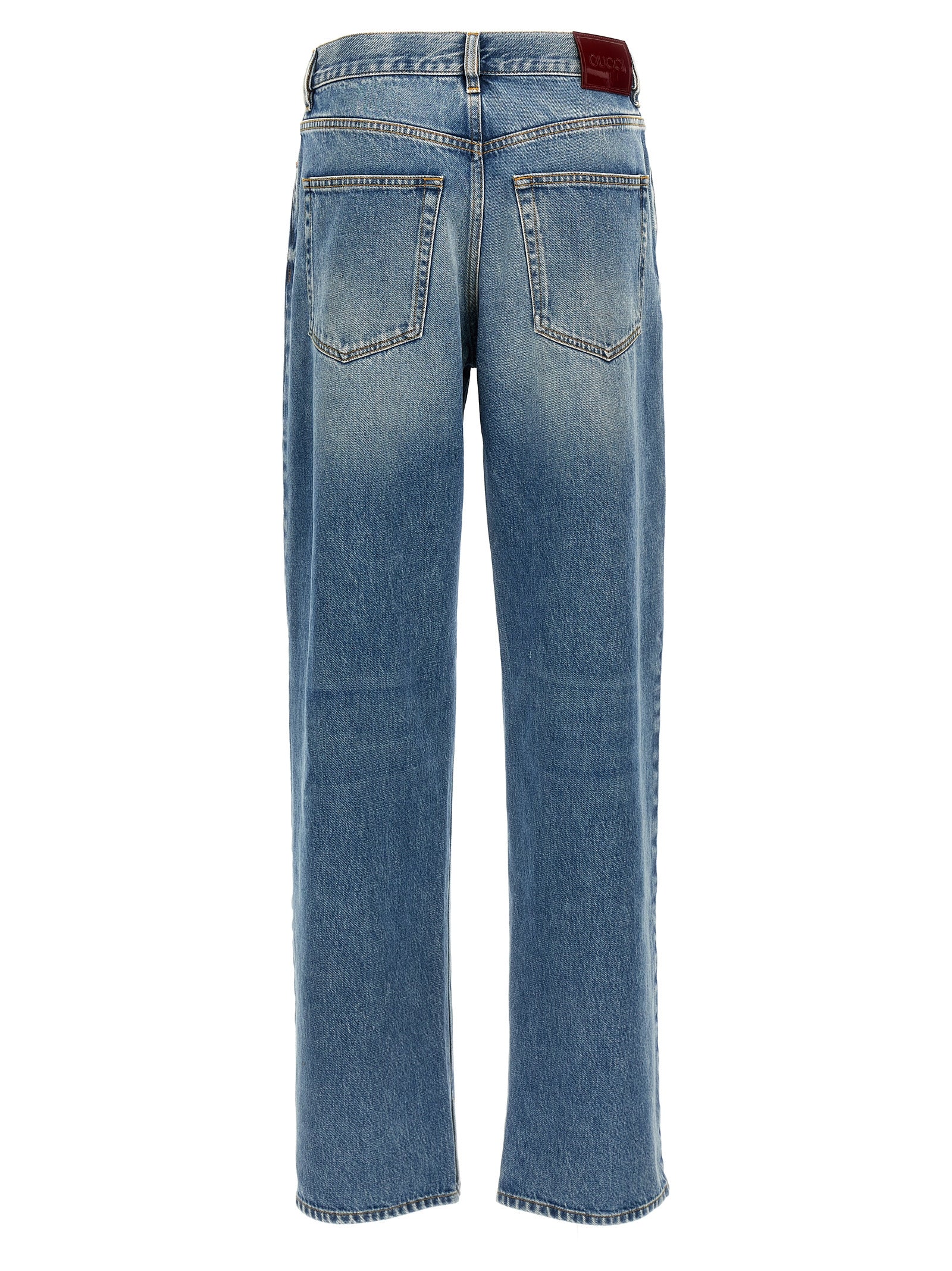Jeans boyfriend en coton bleu de Gucci, coupe décontractée, avec détails de couture visibles.