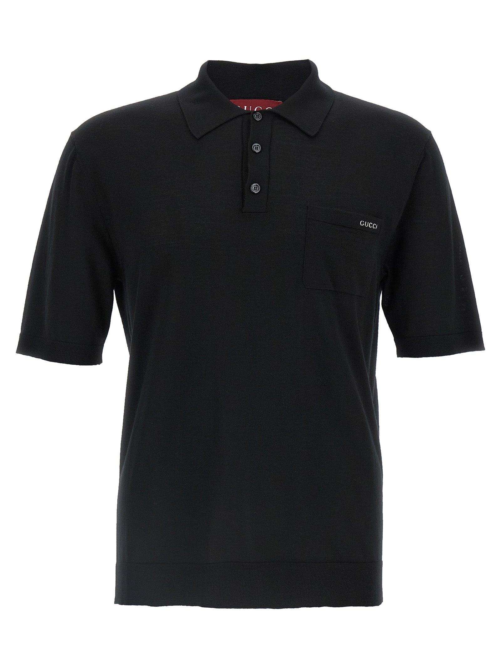 Chemise polo en laine noire Gucci, vue en détail, avec col et logo Gucci visible.