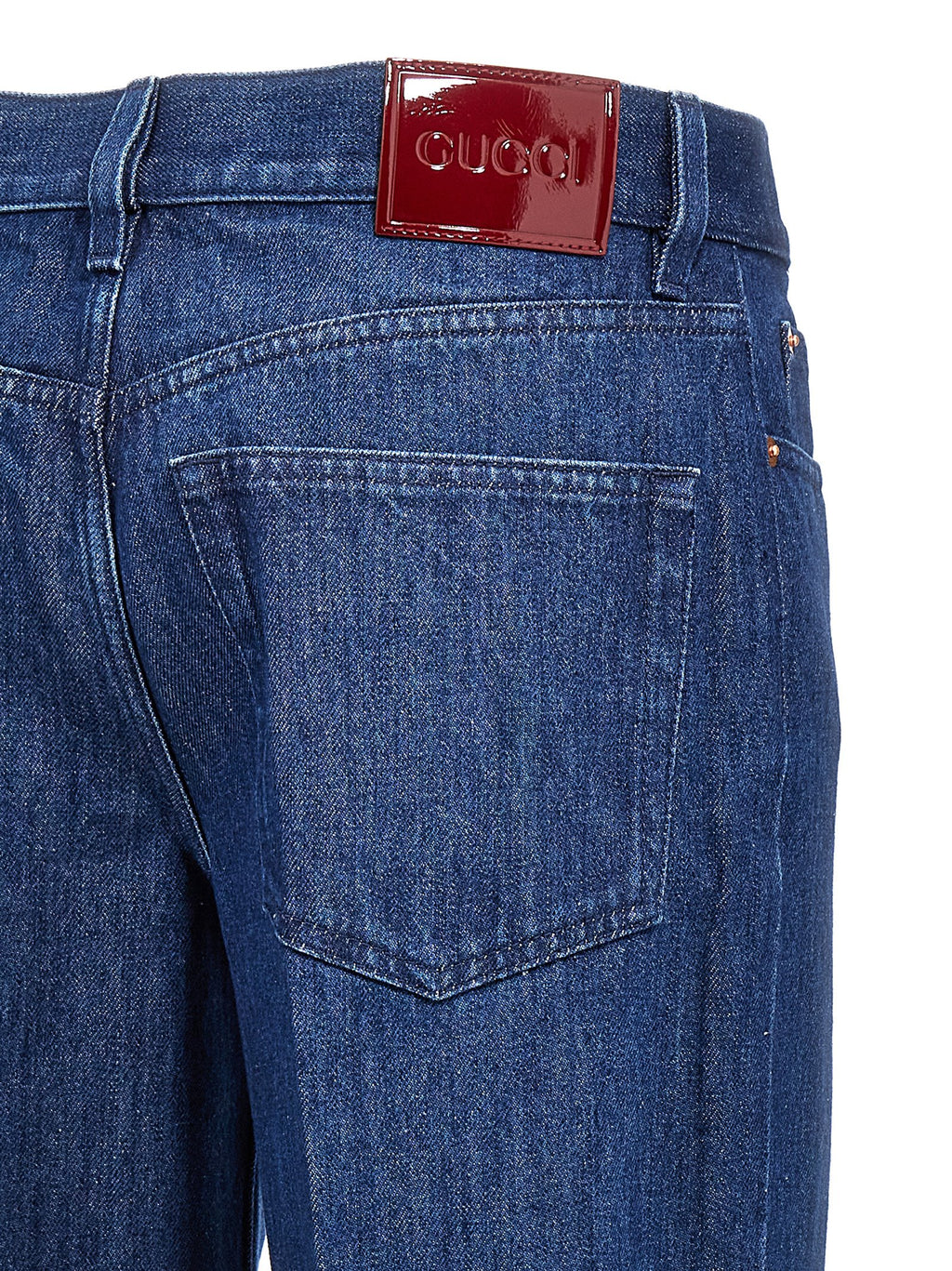 Jeans droits en coton bleu Gucci, style classique, visible avec une coupe droite et détails de la marque Gucci.