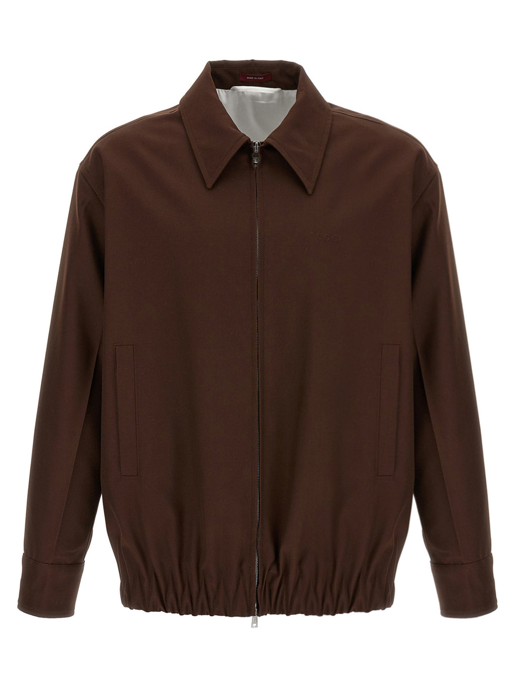 Veste longue en laine marron Gucci, coupe élégante avec détails sophistiqués, portée sur un mannequin.