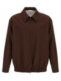 Veste longue en laine marron Gucci, coupe élégante avec détails sophistiqués, portée sur un mannequin.