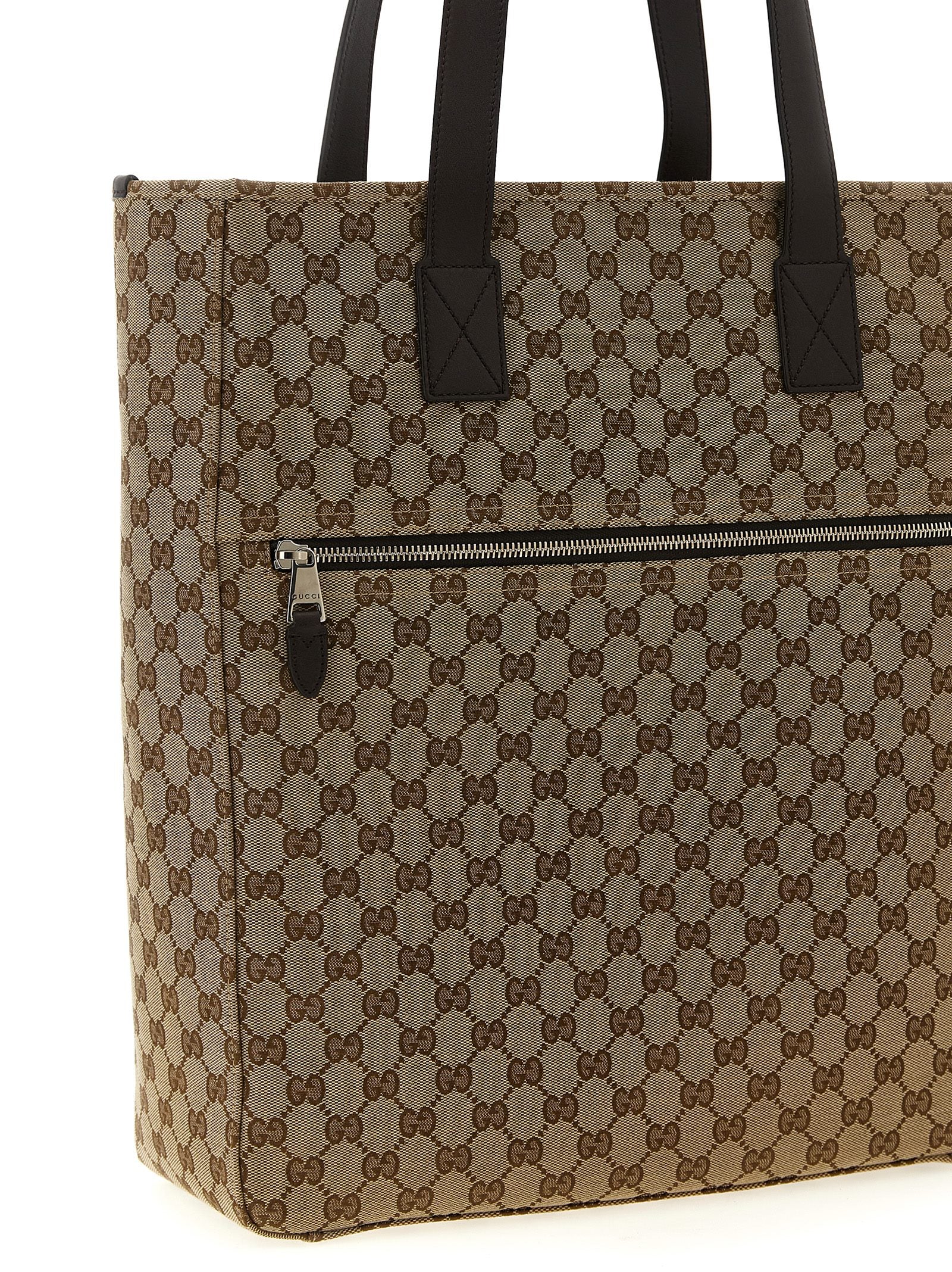 Sac à bandoulière en polyester marron Gucci, design élégant avec logo Gucci visible sur le devant.