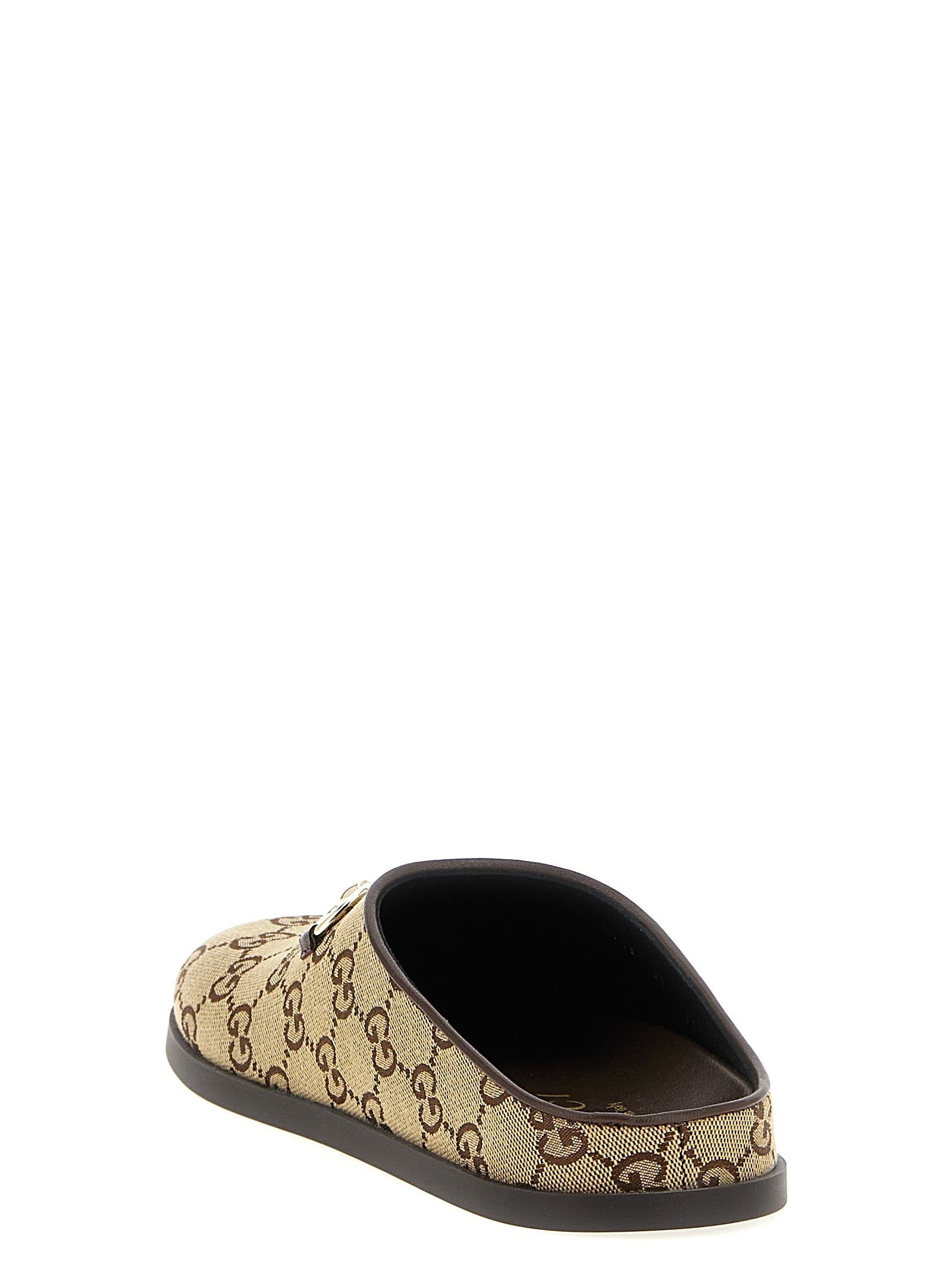 Mules en coton beige Gucci, confortables et élégants, avec semelle en cuir et design sophistiqué.
