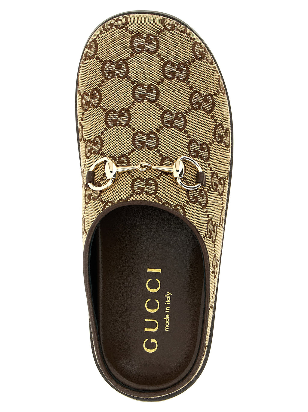 Mules en coton beige de Gucci, chaussures élégantes pour femmes avec design épuré et logo Gucci visible.