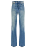 Pantalon Gucci en coton bleu à jambe évasée, style décontracté, visible sur l’image.