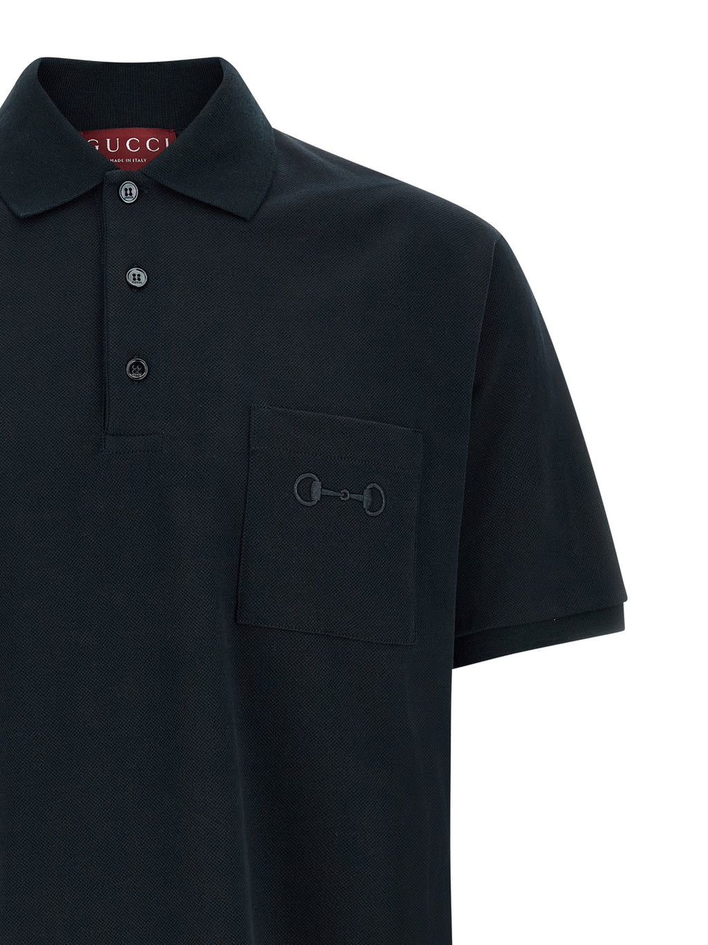 Chemise polo en coton bleu Gucci, vue de face, avec col et boutons visibles, style élégant et décontracté.