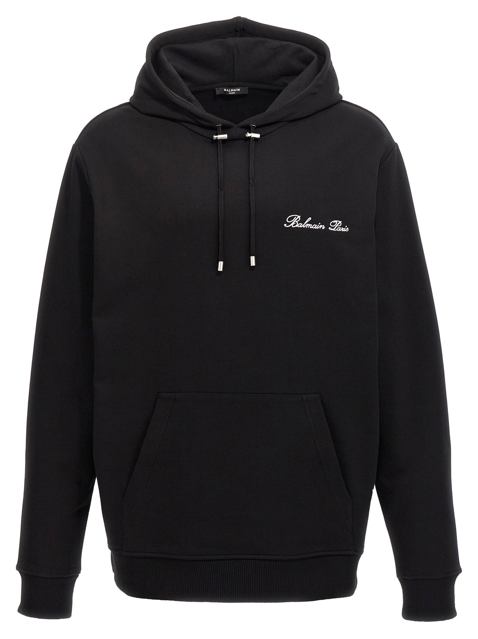 Sweat-shirt en coton noir de Balmain, style décontracté, avec logo discret sur la poitrine, porté sur un mannequin.