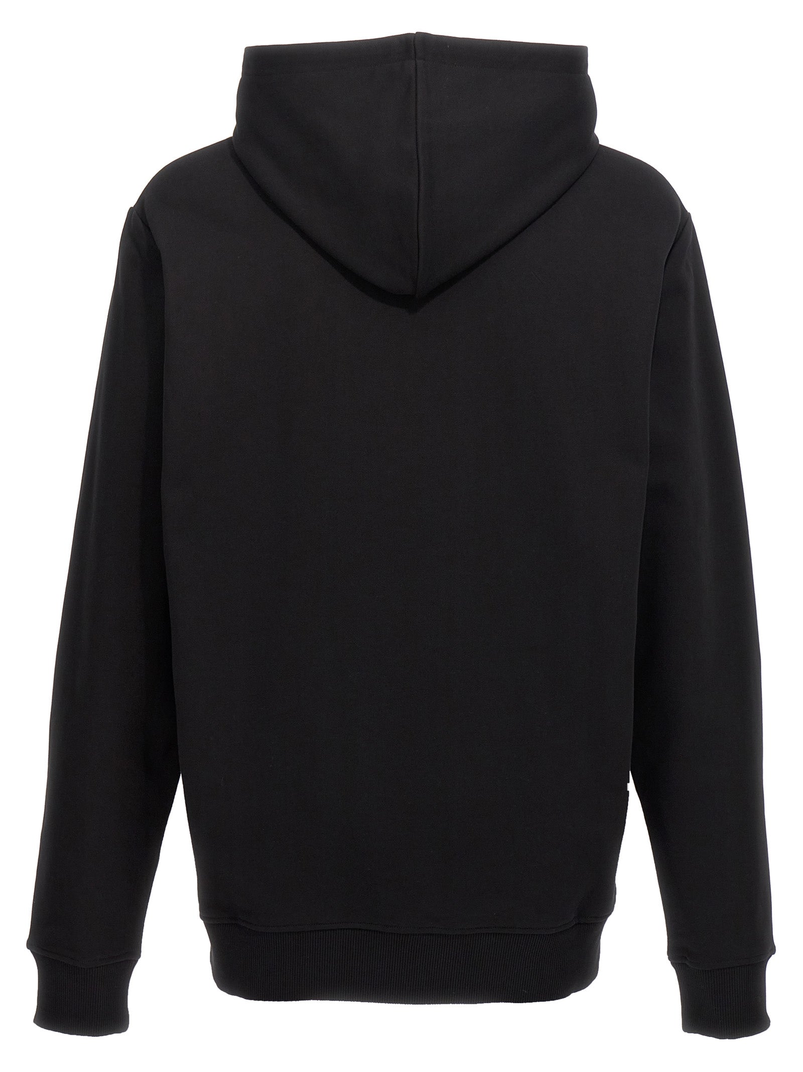 Sweatshirt en coton noir Balmain, silhouette décontractée, avec logo discret, porté sur un modèle.