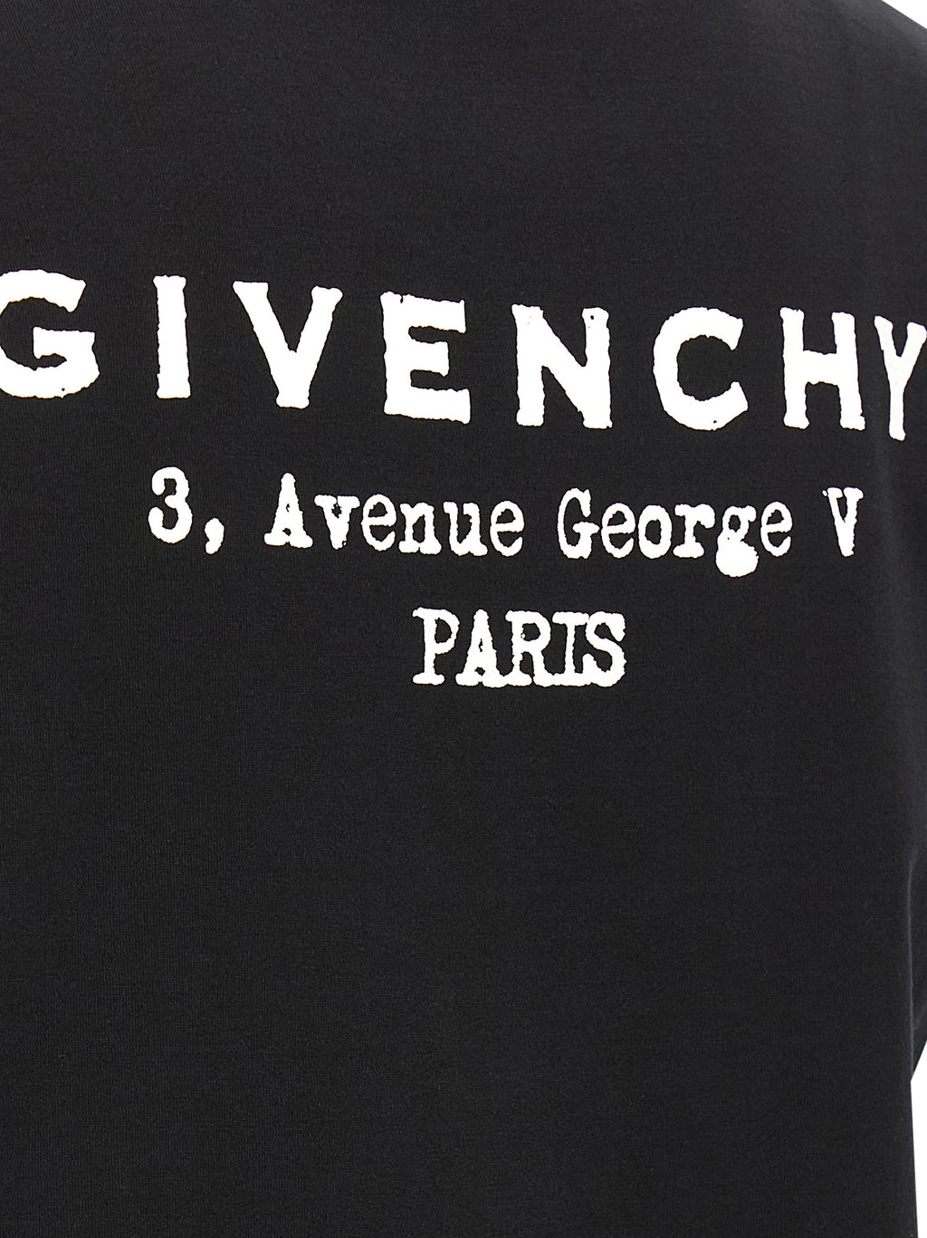 T-shirt en coton bicolore Givenchy, coupe décontractée, design moderne avec logo, porté sur mannequin.