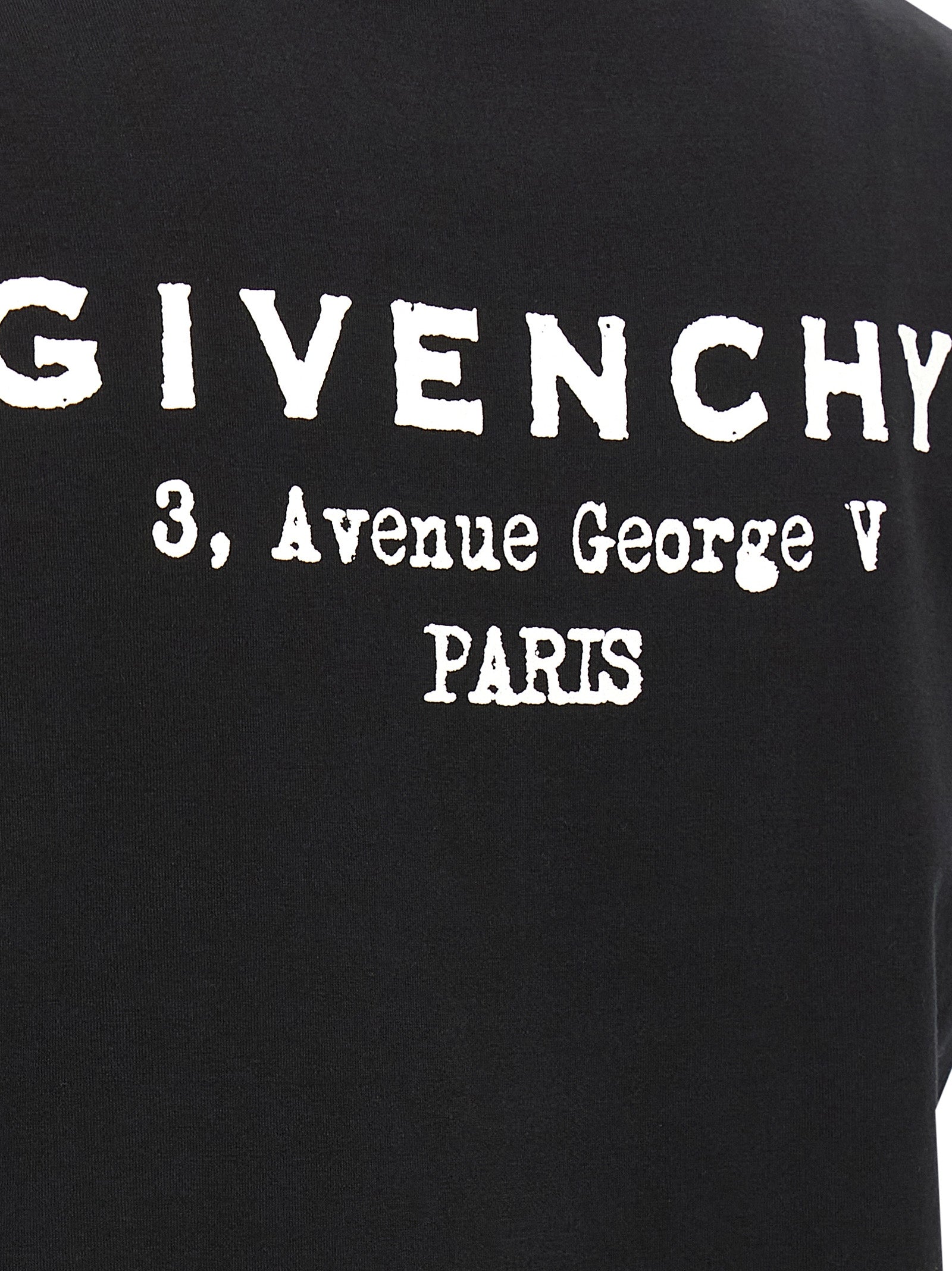T-shirt en coton bicolore Givenchy, coupe décontractée, design moderne avec logo, porté sur mannequin.