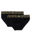 Culottes en coton noir de la marque Versace, avec logo emblématique et design élégant visible sur le tissu.