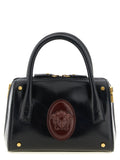 Sac à main en cuir de veau noir de la marque Versace, avec détails élégants et design sophistiqué.