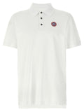 Chemise polo blanche en coton de la marque Canada Goose, avec col et boutons visibles.