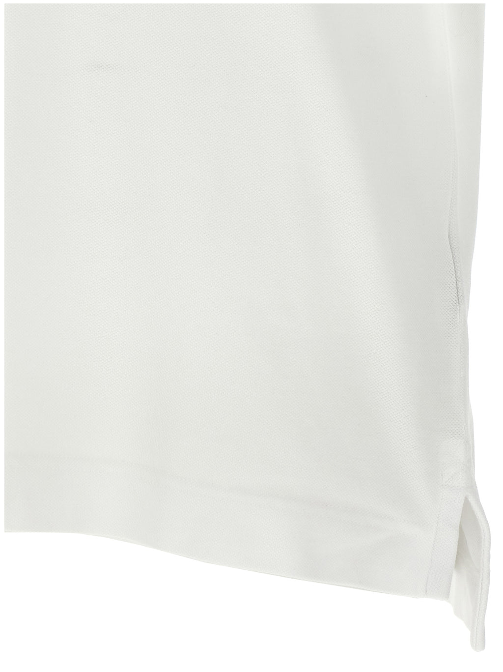 Chemise polo en coton blanche Canada Goose, vue de face, avec col et boutons visibles.