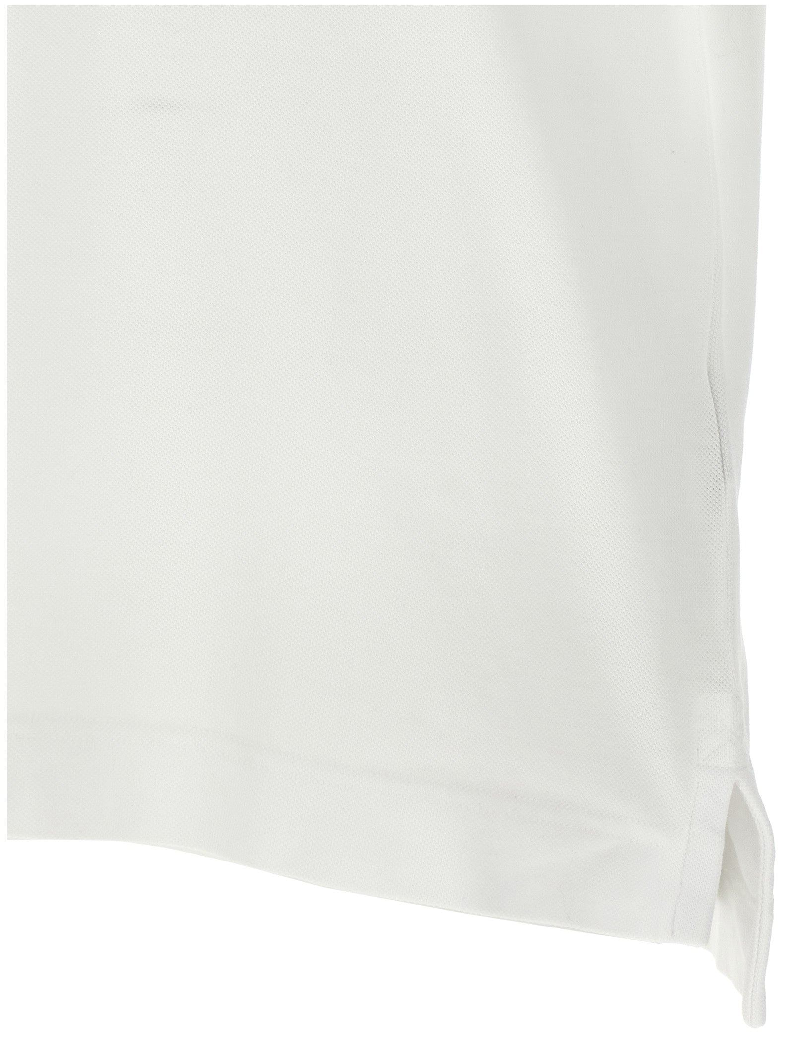Chemise polo en coton blanche Canada Goose, vue de face, avec col et boutons visibles.