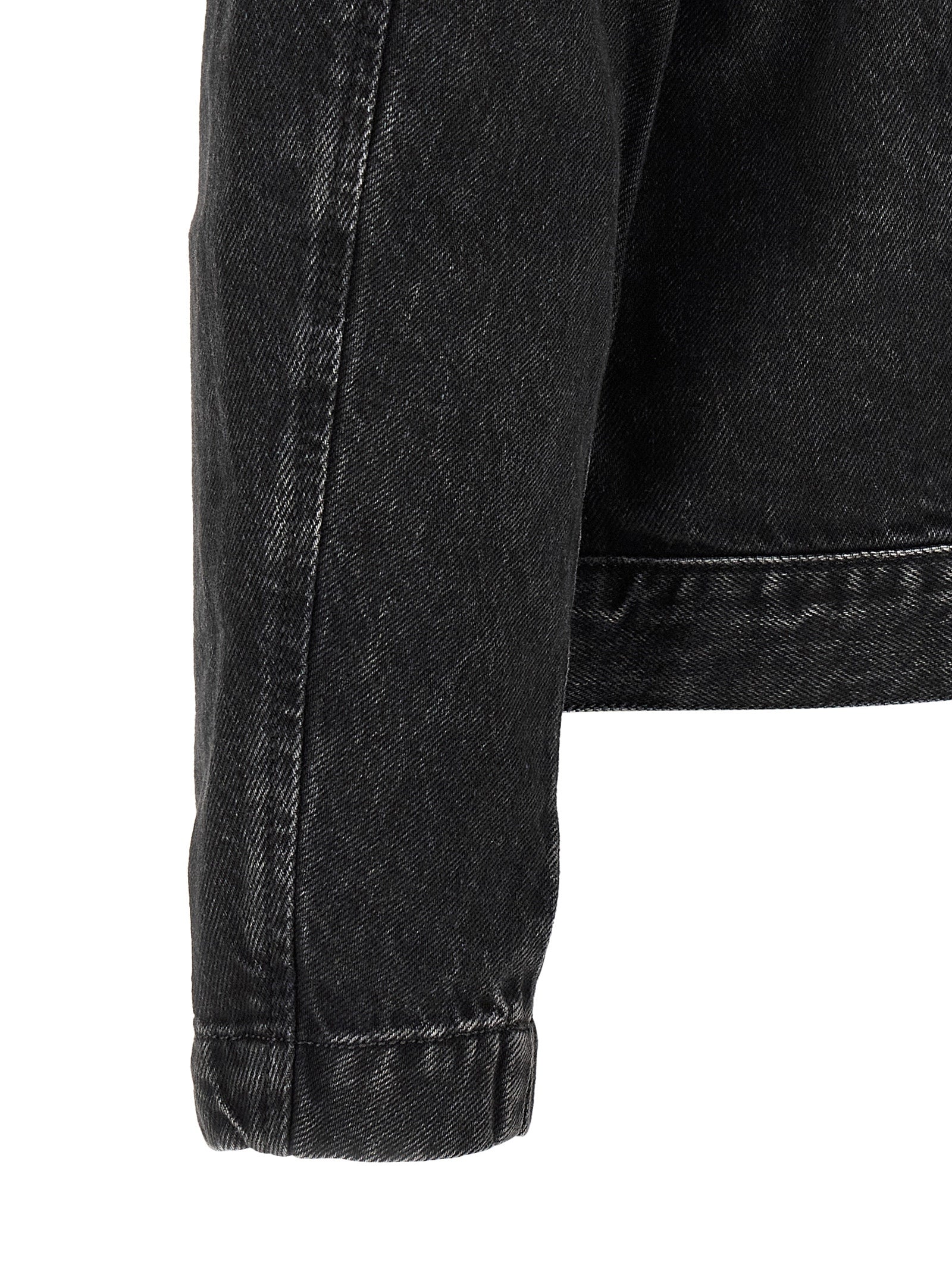 Veste en denim noir Diesel en coton, style classique avec boutons et poches avant, vue de face.