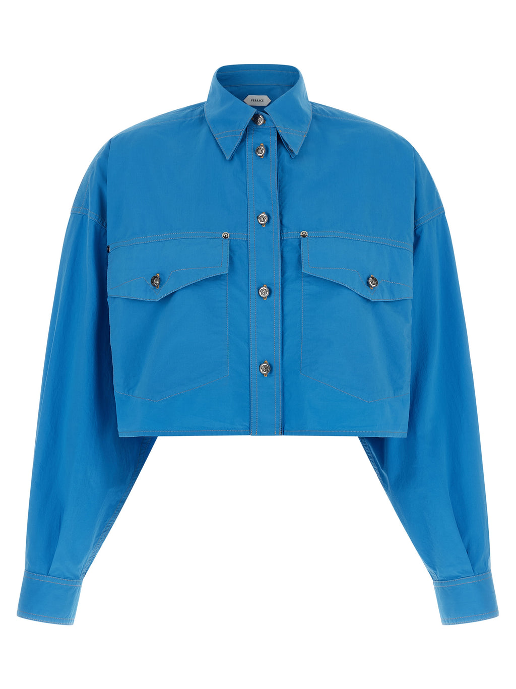 Blouse en coton bleue de la marque Versace, style élégant et sophistiqué, visible avec détails de la couture et du tissu.
