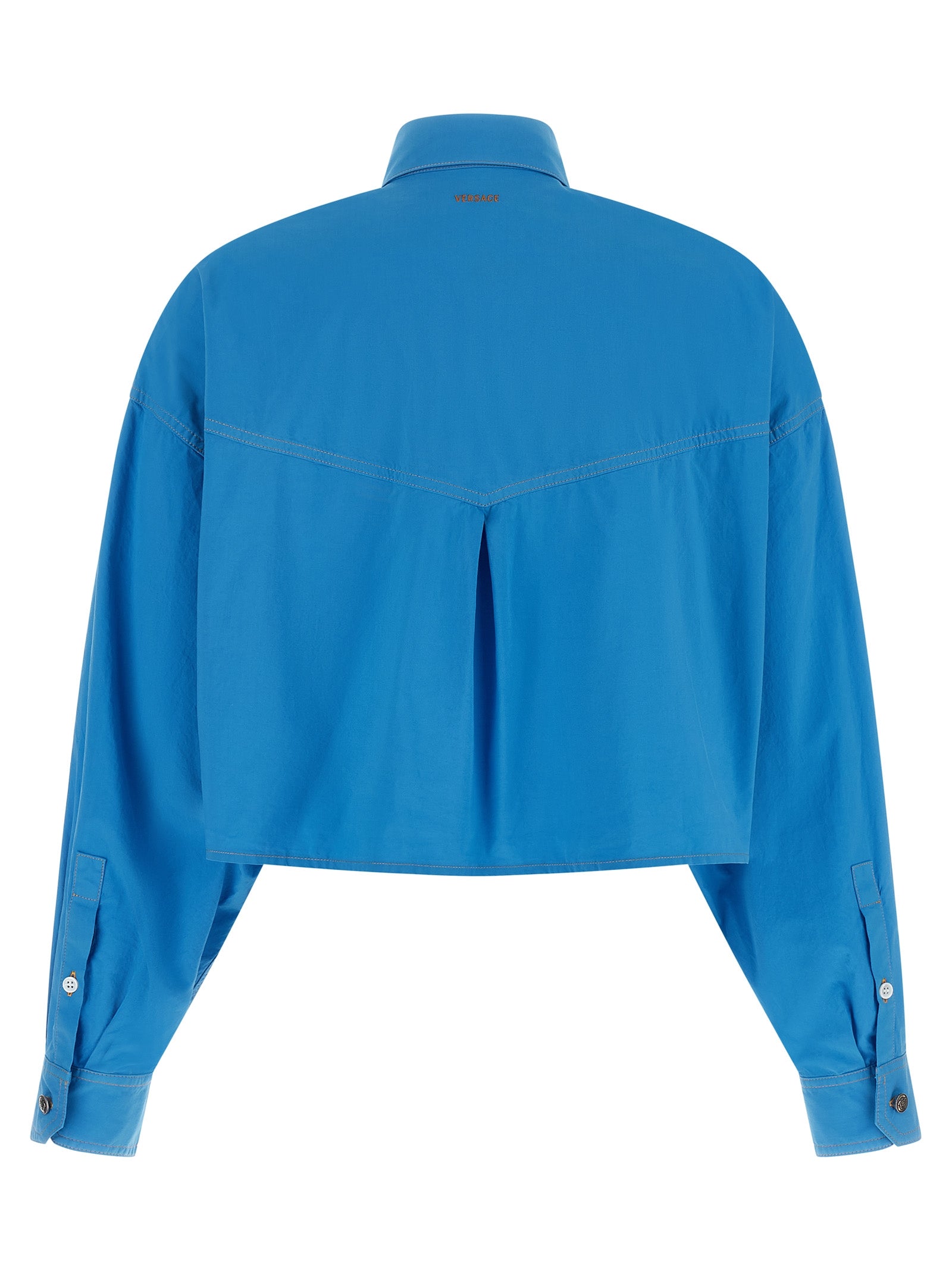 Blouse en coton bleu Versace avec logo distinctif, manches longues et coupe élégante, vue de face.