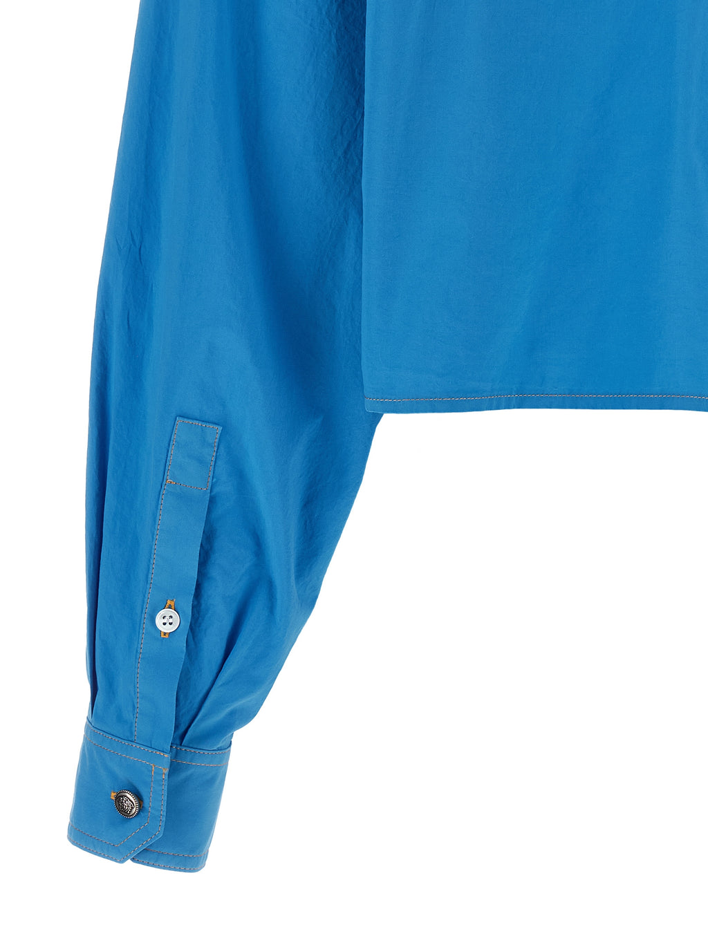 Blouse en coton bleu de la marque Versace, détails élégants et coupe classique, visible sur l'image.