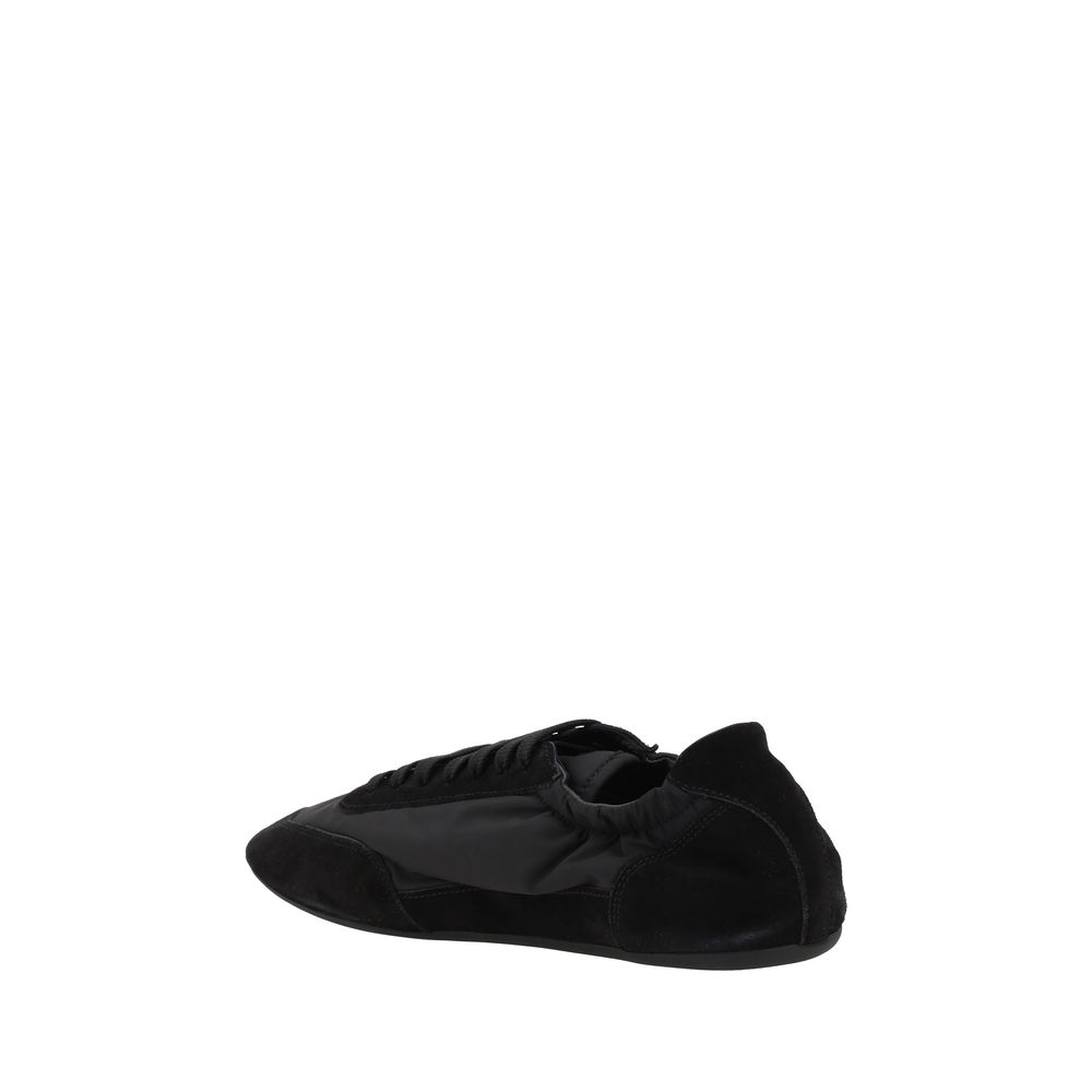 Chaussures de sport en caoutchouc noir Prada, baskets athlétiques élégantes avec design moderne et confortable.