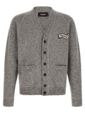 Cardigan en laine grise Dsquared² porté par un mannequin, détails de couture visibles, style décontracté et élégant.
