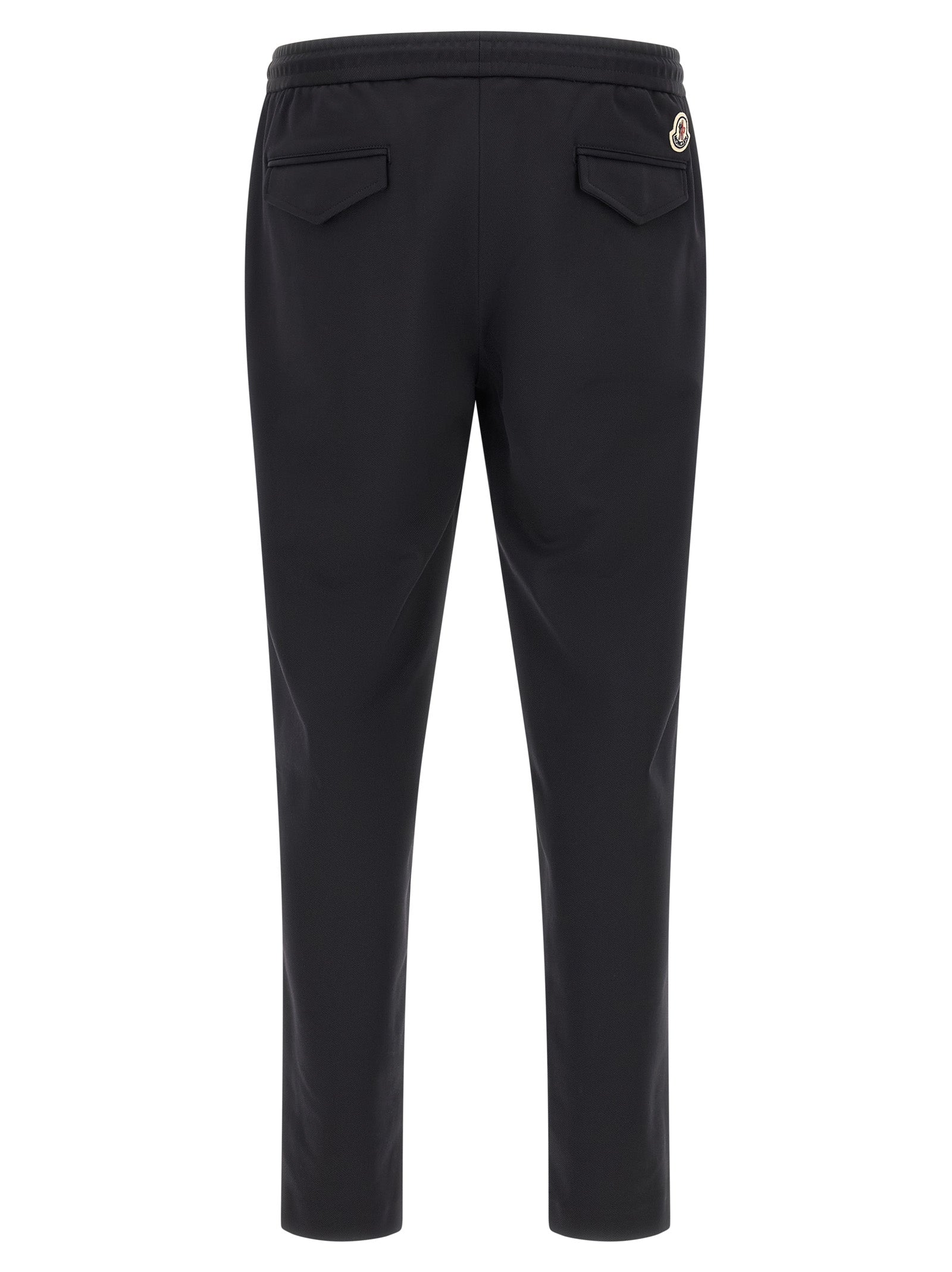 Pantalons de sport Moncler noirs en polyamide, joggers pour l'entraînement, affichant une coupe décontractée et tissu léger.