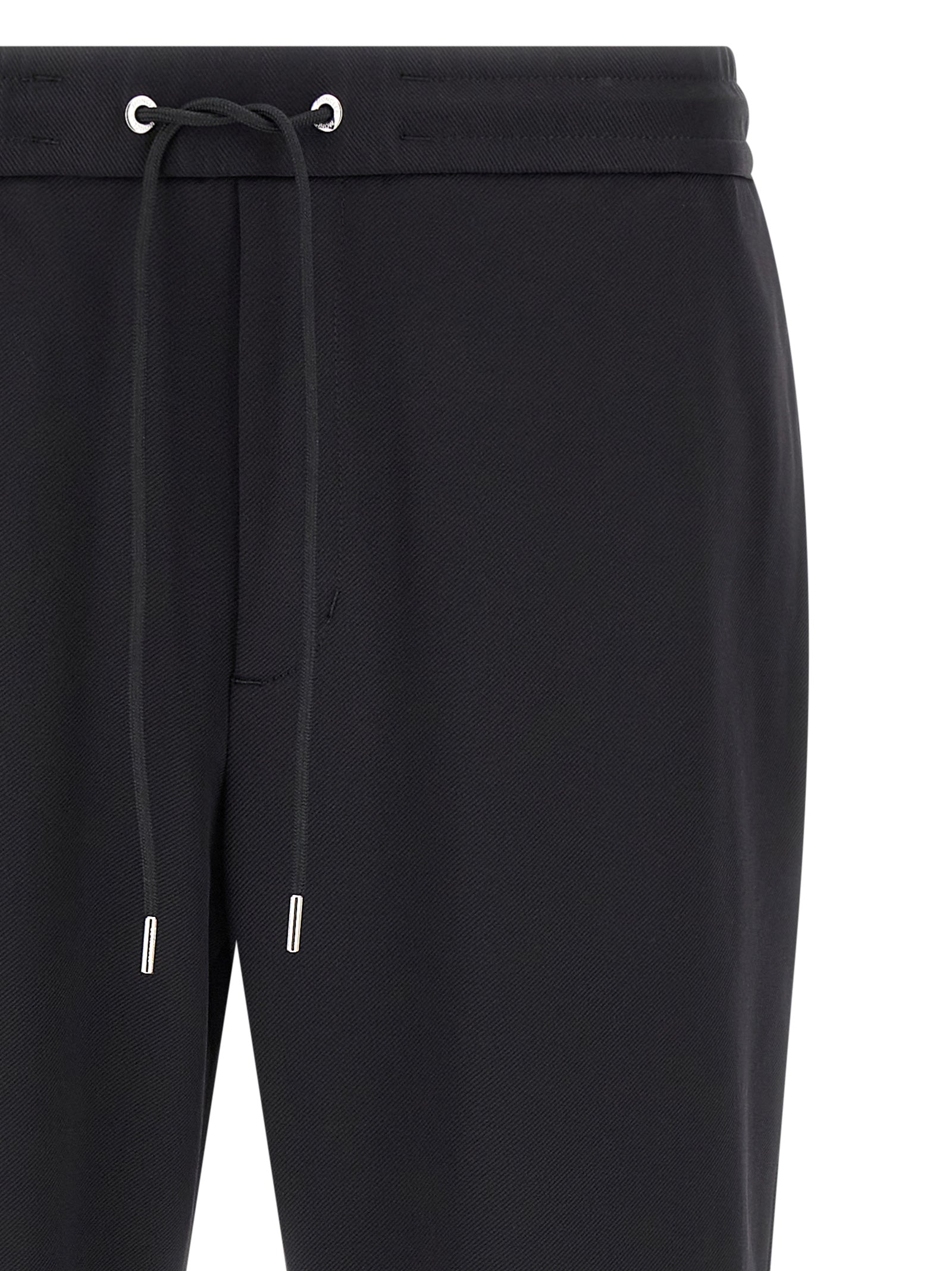 Pantalon de sport Moncler noir en polyamide, jogging pour l'entraînement, avec ceinture élastique et poches latérales.