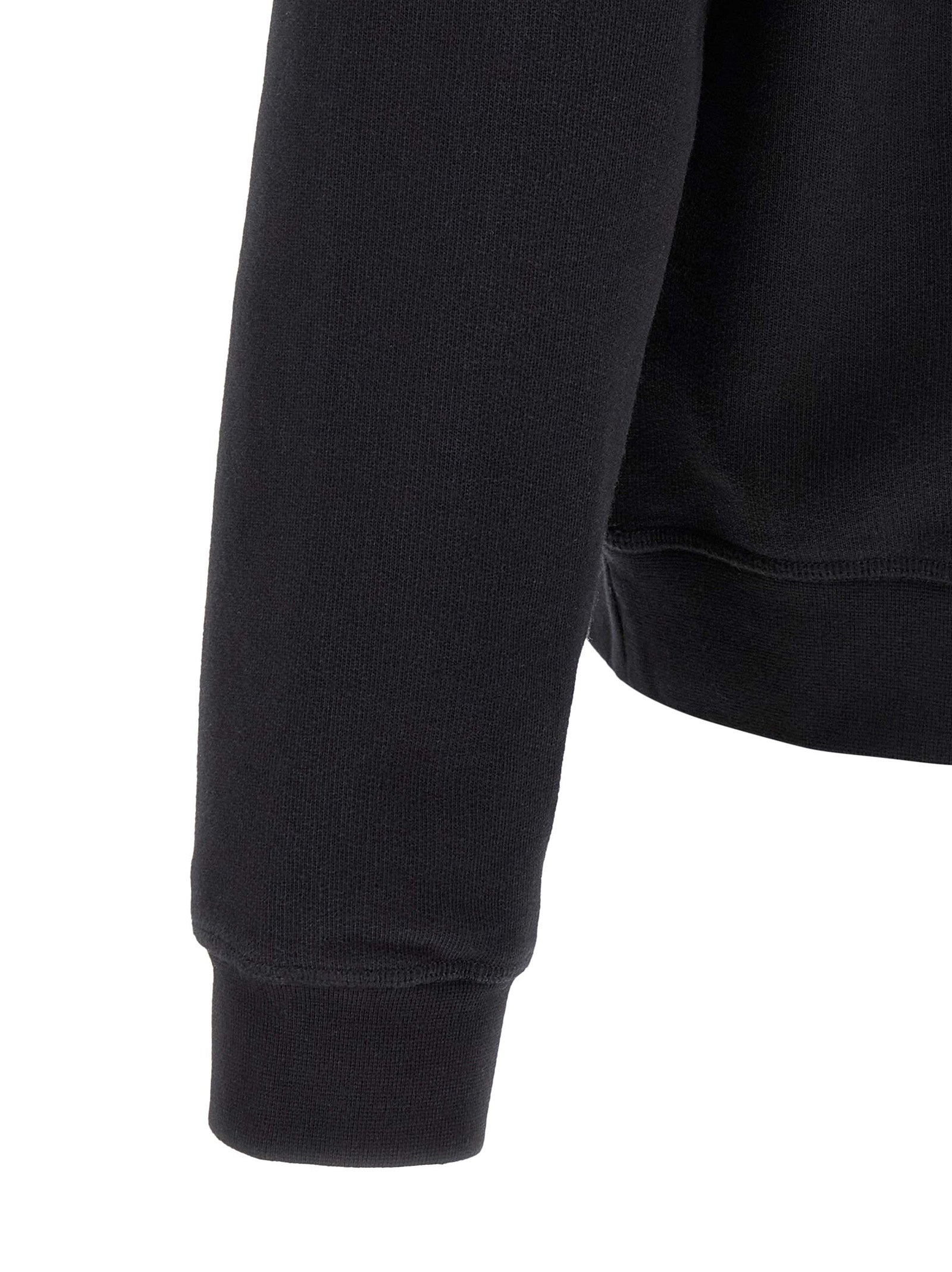 Sweatshirt en coton noir de Dsquared², vêtement décontracté avec logo discret, porté par un mannequin.