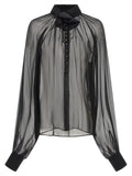 Blouse en soie noire Dolce & Gabbana, élégante et fluide, avec détails sophistiqués pour un look chic et raffiné.