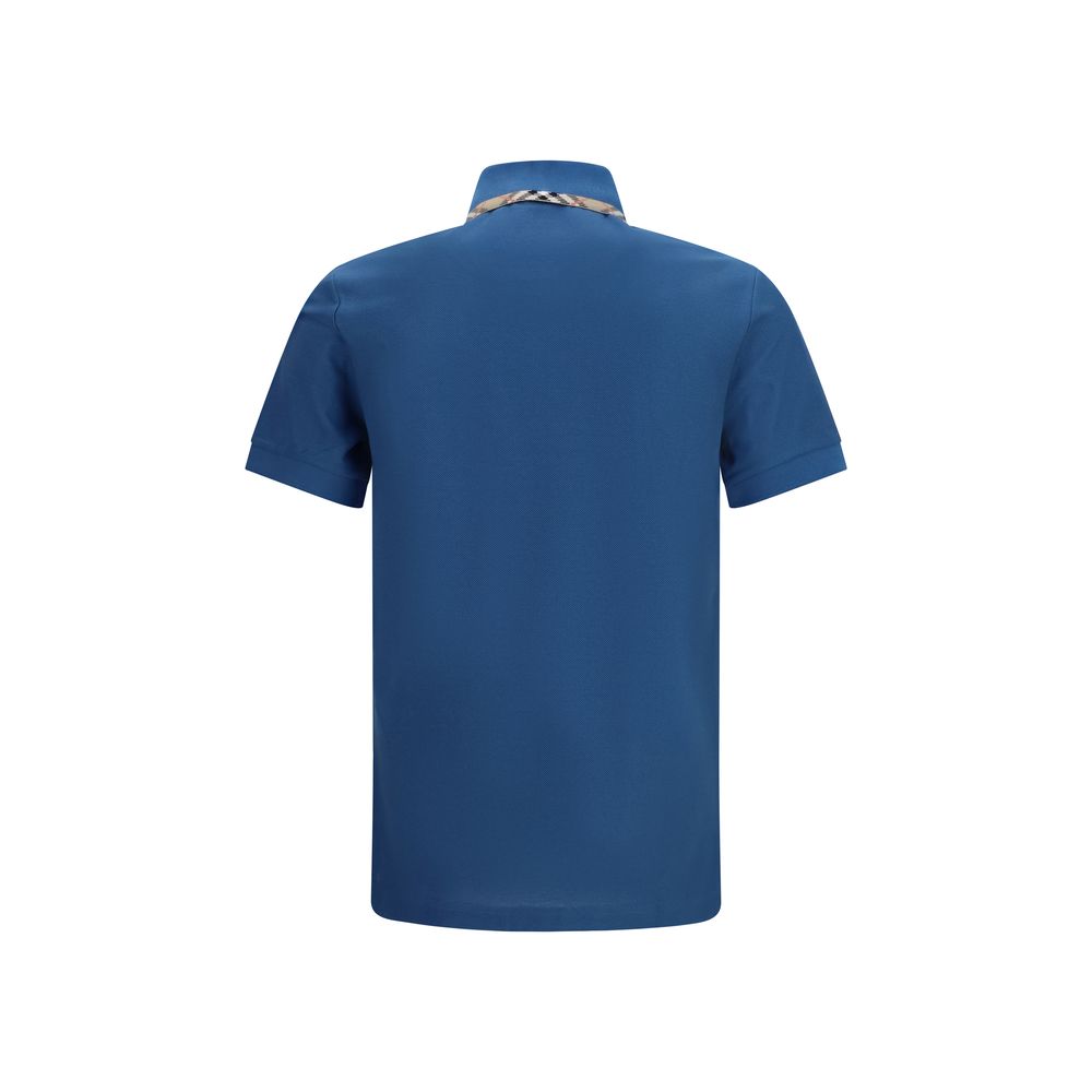 Polo en coton bleu de Burberry, chemise polo élégante avec logo discret, portée décontractée et classique.