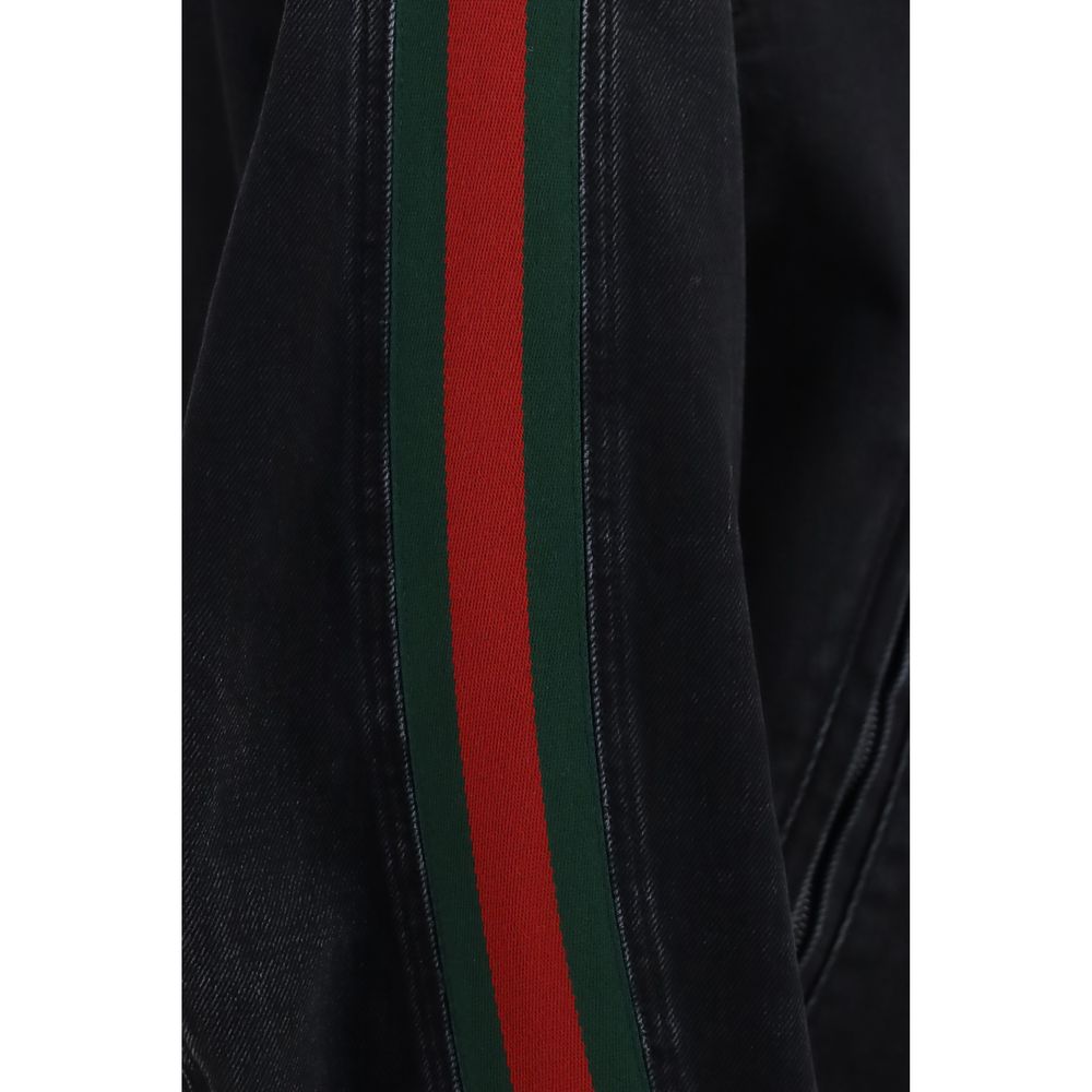 Veste en coton noir de style biker Gucci, avec détails en cuir et fermeture éclair visible.