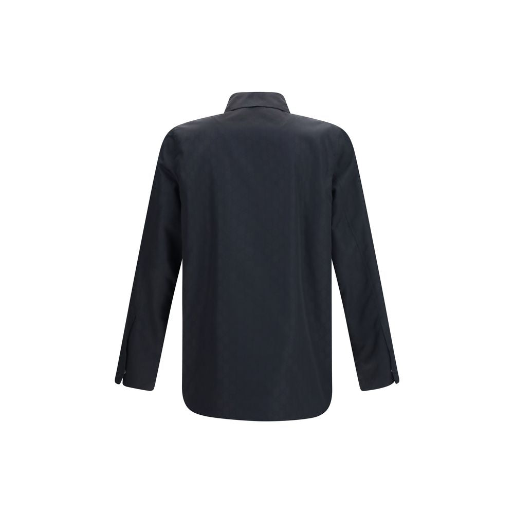 Veste longue en polyamide noire de la marque Gucci, coupe moderne avec fermeture éclair et col haut.