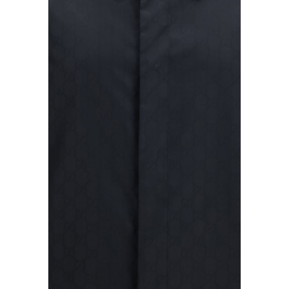 Veste longue en polyamide noire de Gucci, style élégant, avec fermeture à glissière et détails modernes.