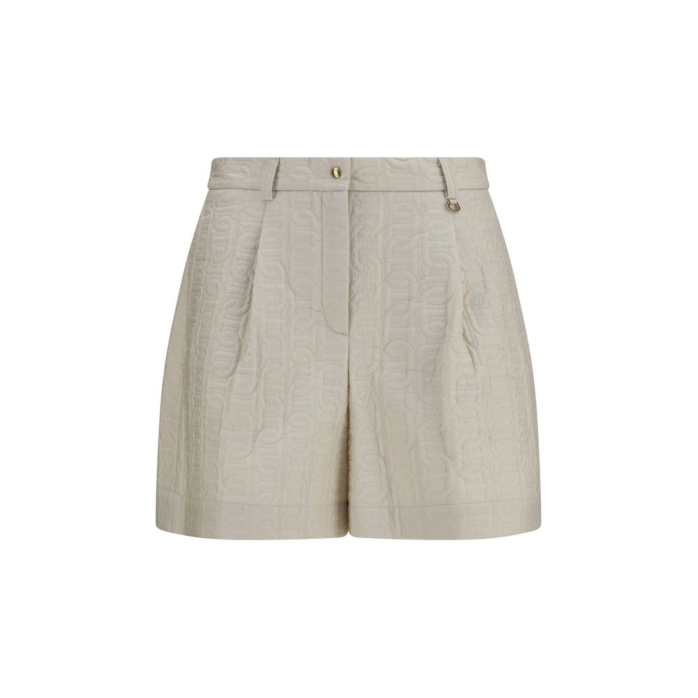 Shorts bermuda beige en polyamide Moncler, légers et décontractés, affichant une coupe classique avec logo discret sur la poche arrière.
