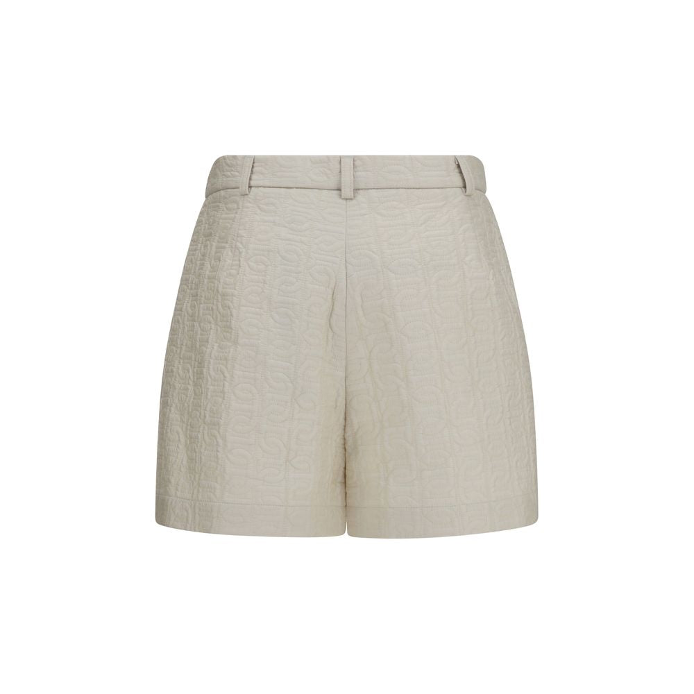 Shorts bermuda beige en polyamide de la marque Moncler, décontractés et modernes, parfaits pour l'été.