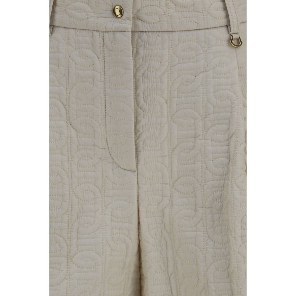 Shorts bermuda en polyamide beige Moncler, style décontracté avec poches latérales et taille ajustable, pour un look élégant et confortable.