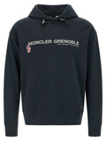 Sweatshirt en coton bleu Moncler Grenoble, style décontracté, col rond, manches longues, texture douce visible sur l'image.
