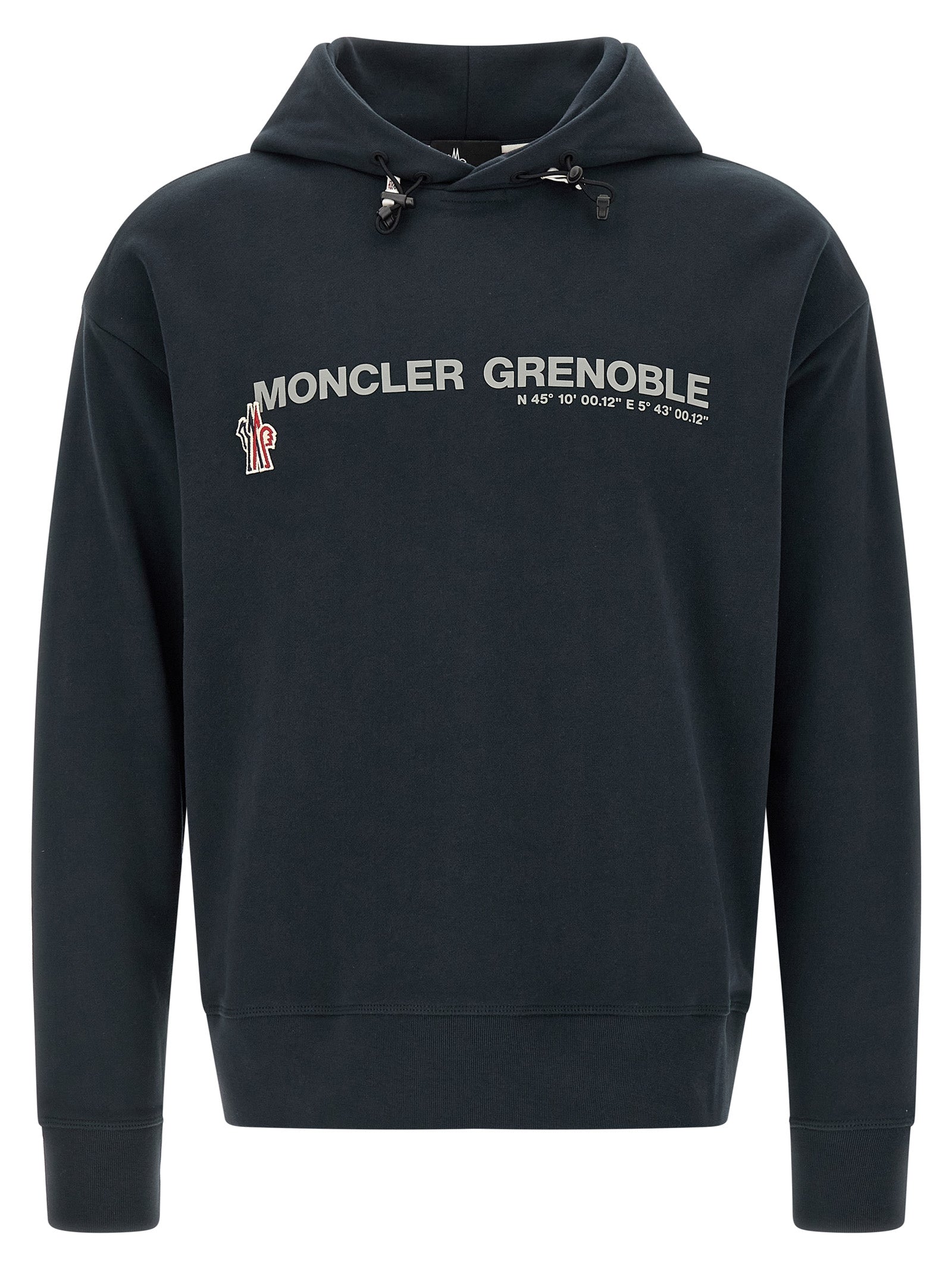Sweatshirt en coton bleu Moncler Grenoble, style décontracté, col rond, manches longues, texture douce visible sur l'image.