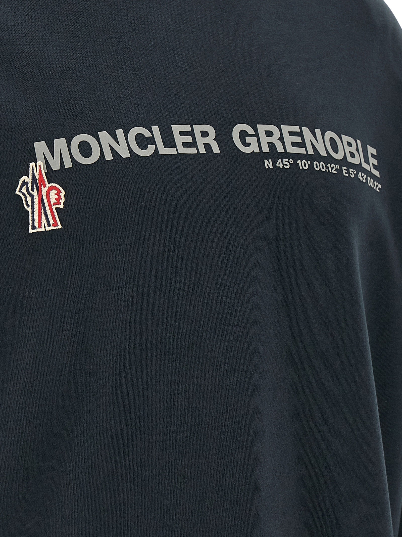 Sweat-shirt bleu en coton Moncler Grenoble, veste décontractée avec logo visible, confortable et tendance pour le sport ou la casual.