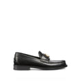 Mocassins Gucci en cuir noir pour homme, chaussons slip-on élégants avec finition soignée et semelle en cuir.