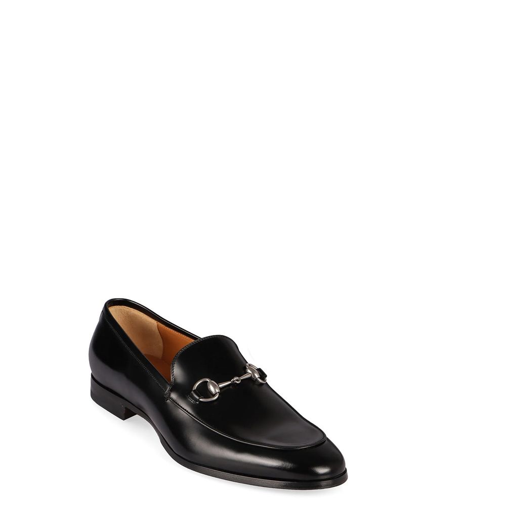 Chaussures Gucci en cuir de veau noir, mocassins sans lacets slip-on avec semelle en cuir, élégantes et classiques.