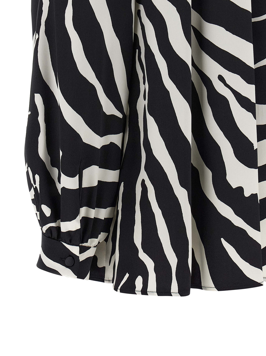 Blouse en soie bicolore Dolce & Gabbana, style élégant avec détails raffinés et coupe fluide.
