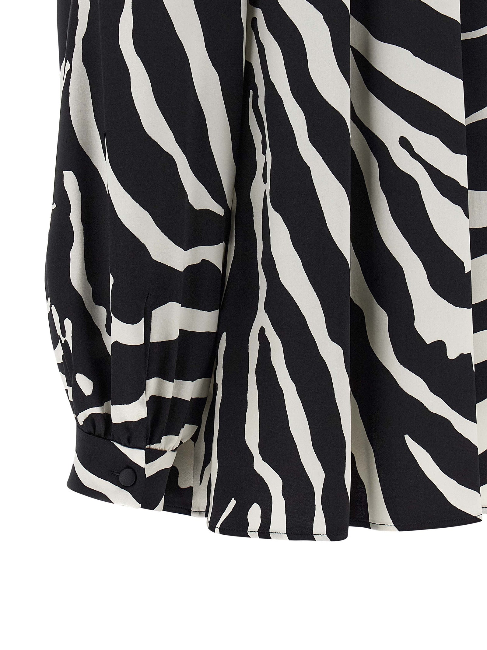 Blouse en soie bicolore Dolce & Gabbana, style élégant avec détails raffinés et coupe fluide.