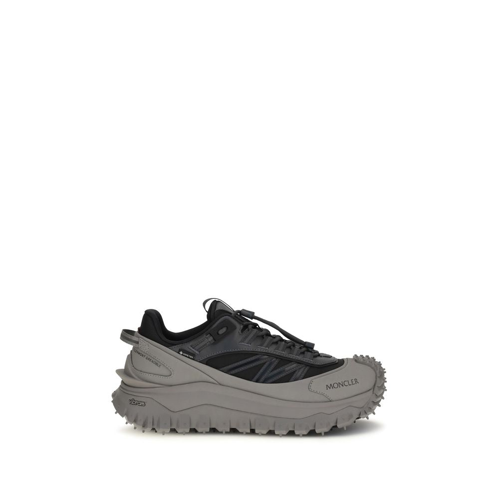 Chaussures de sport Moncler Bos Taurus en cuir de veau gris, baskets athlétiques pour homme, style moderne et confortable.