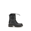 Bottes de pluie noires en PVC de la marque Moncler, résistantes et imperméables, pour un style pratique et élégant.