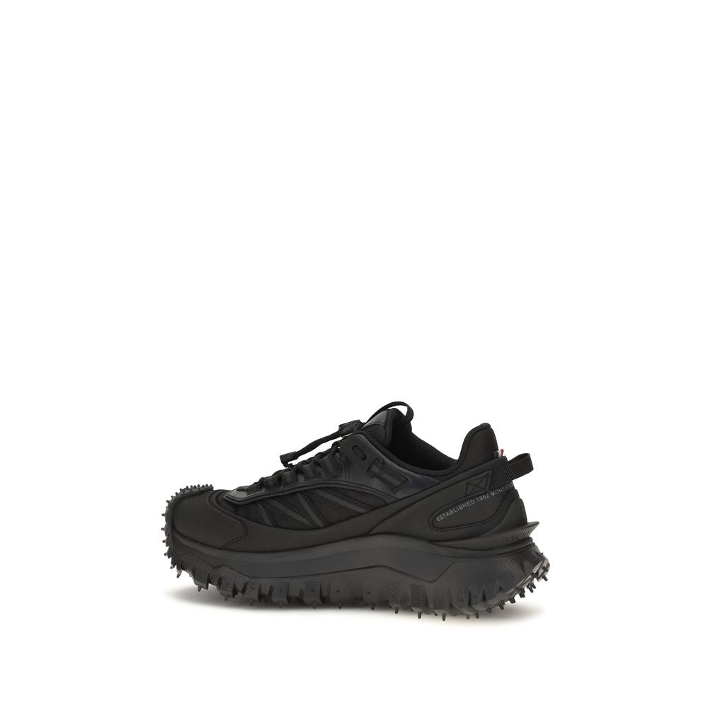 Chaussures de sport Moncler Bos Taurus en cuir noir pour hommes, baskets athlétiques en cuir de veau, style moderne et élégant.