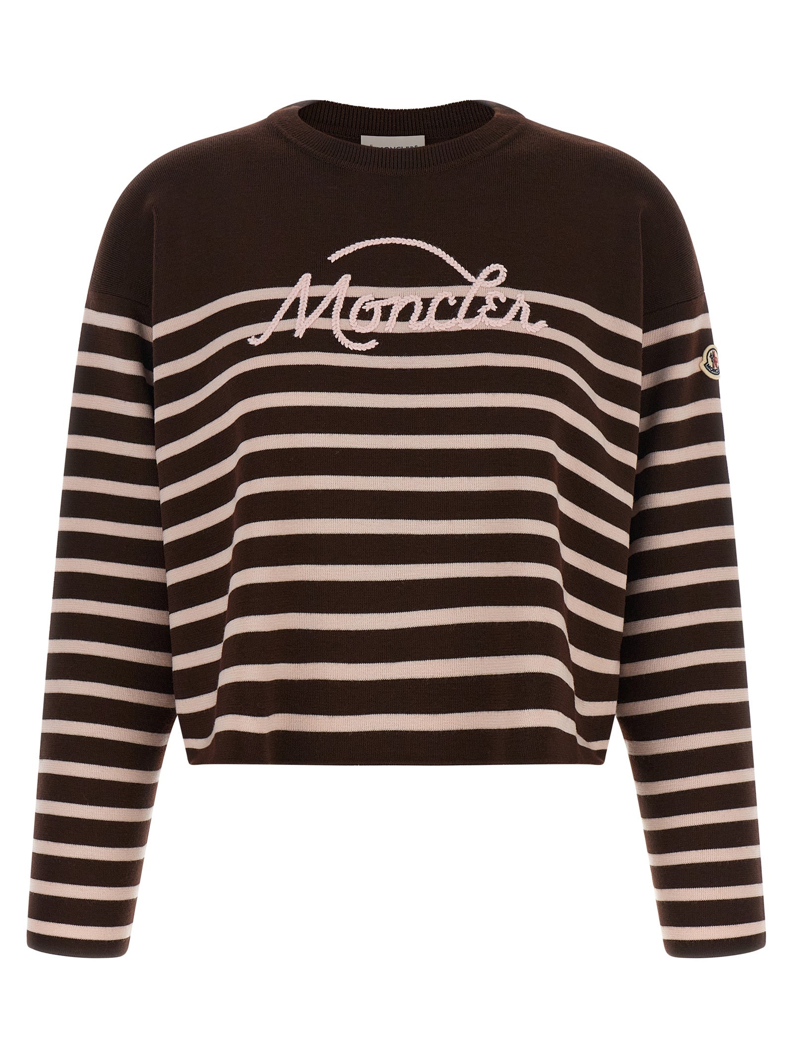 Cardigan blanc en laine vierge Moncler porté, avec col en V et boutons, style élégant et chaud pour homme ou femme.