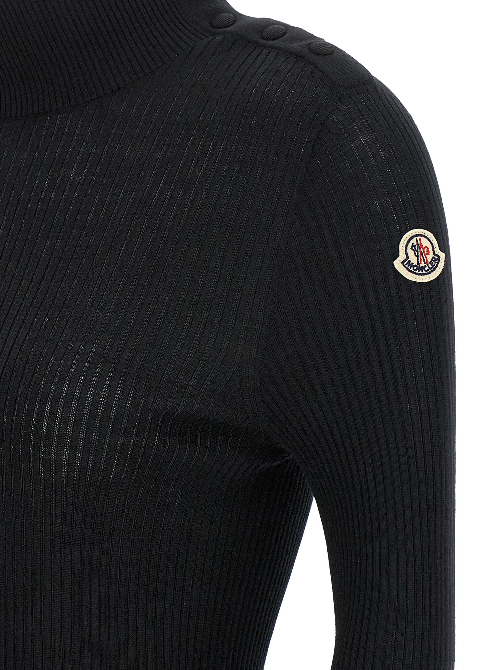 Cardigan noir en laine vierge de la marque Moncler, détail élégant avec boutons sur le devant.